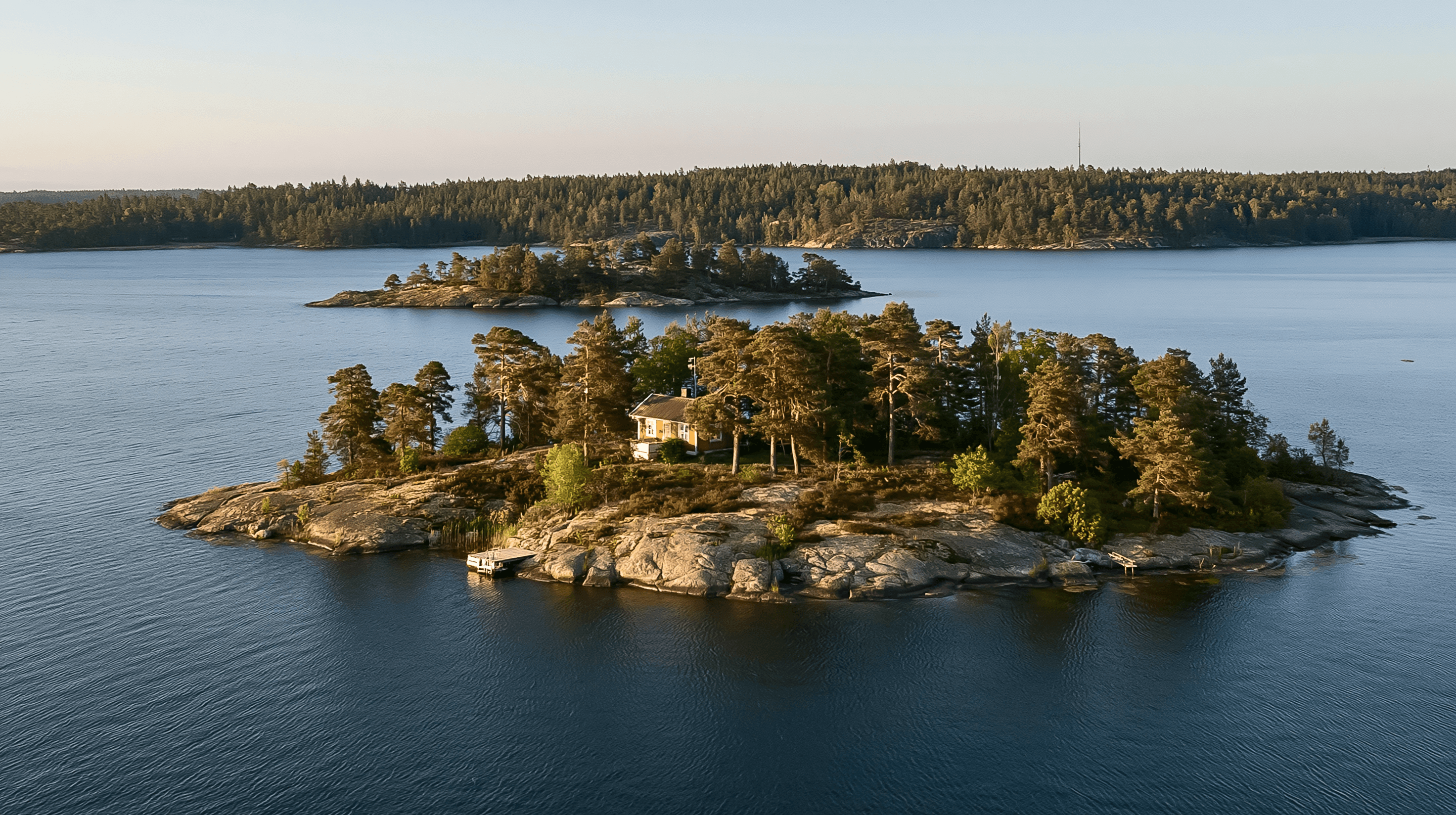 Red house on an archipelago island in golden light